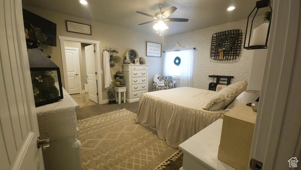 Bedroom featuring light carpet, a ceiling fan, and recessed lighting