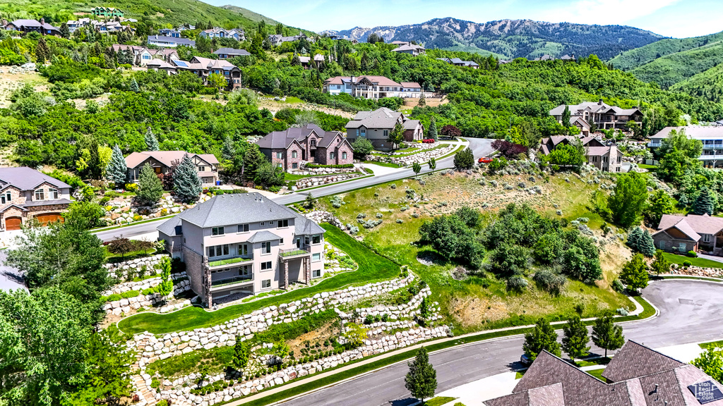 Aerial perspective of suburban area with a mountain backdrop