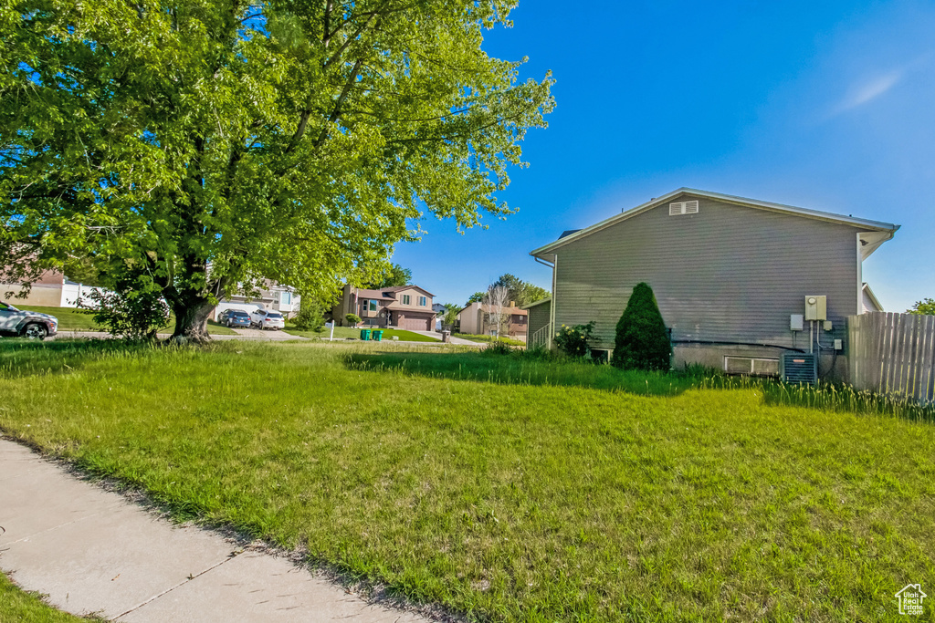 View of side of property with central AC unit