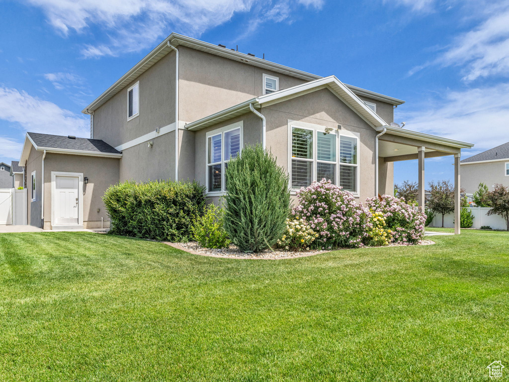View of property exterior with stucco siding