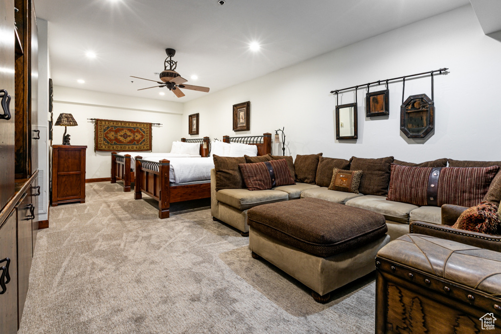 Bedroom featuring recessed lighting, light carpet, baseboards, and a ceiling fan