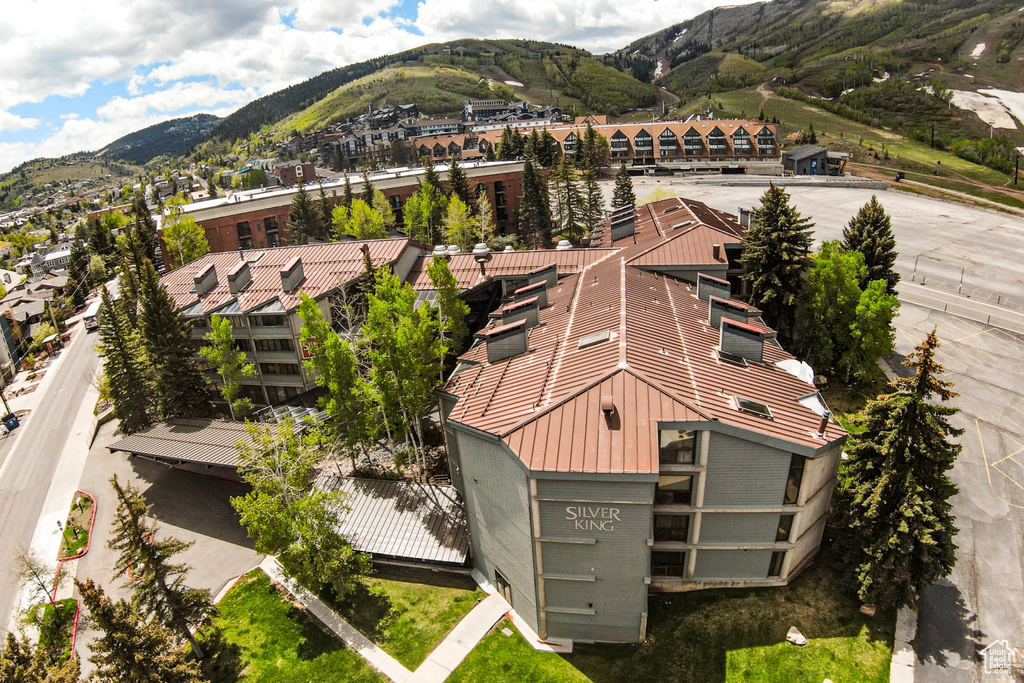 View of subject property featuring a mountainous background