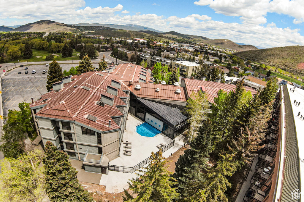Aerial view of a mountainous background and a pool area