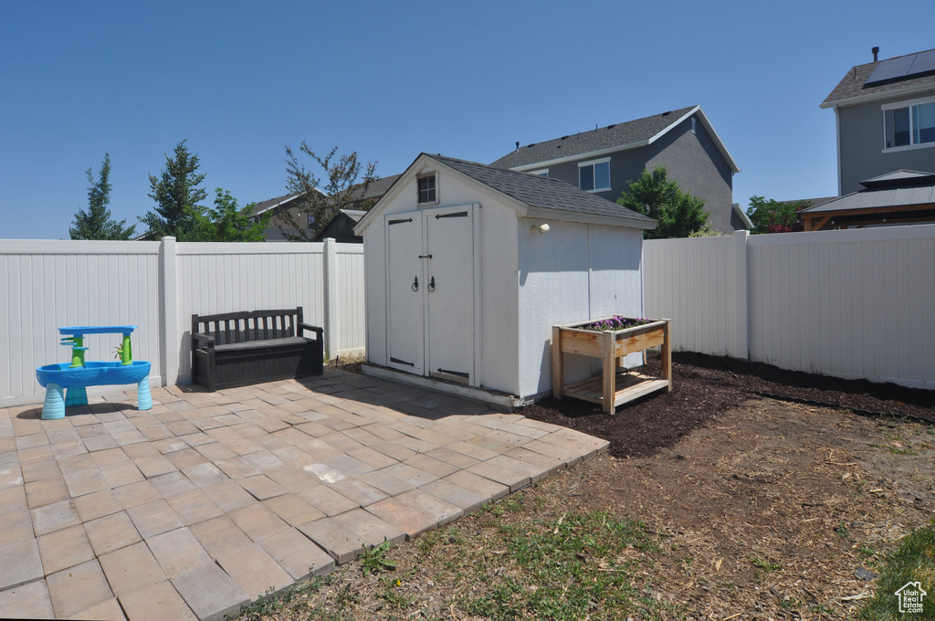 Fenced backyard with a patio