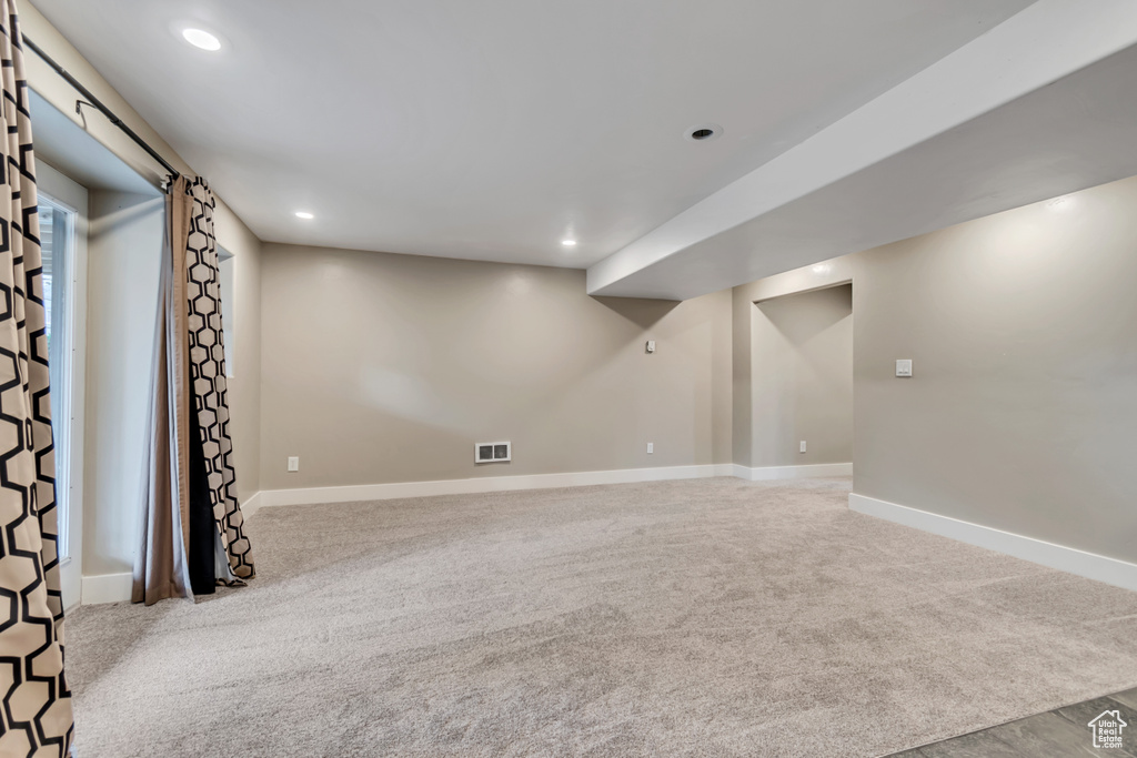 Finished basement featuring carpet flooring, recessed lighting, and baseboards