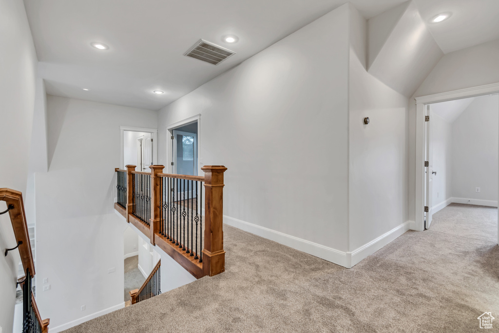Corridor with an upstairs landing, carpet, recessed lighting, and baseboards