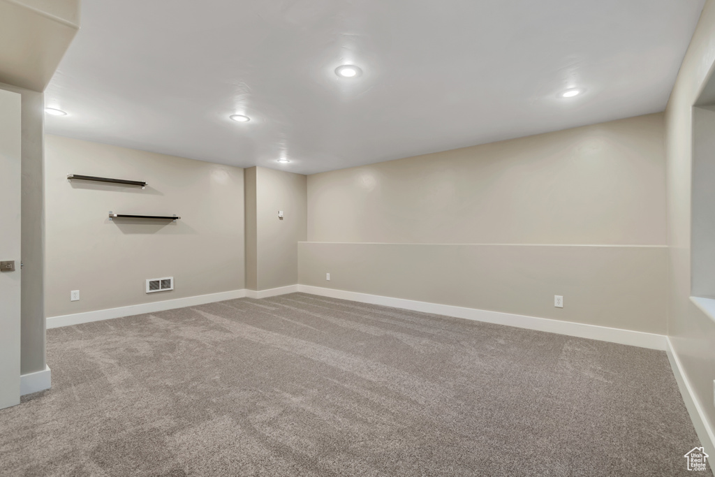 Finished basement with carpet, recessed lighting, and baseboards