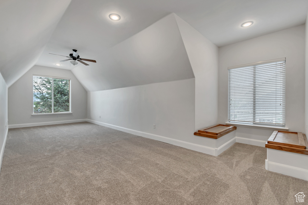 Bonus room with carpet floors, baseboards, lofted ceiling, ceiling fan, and recessed lighting