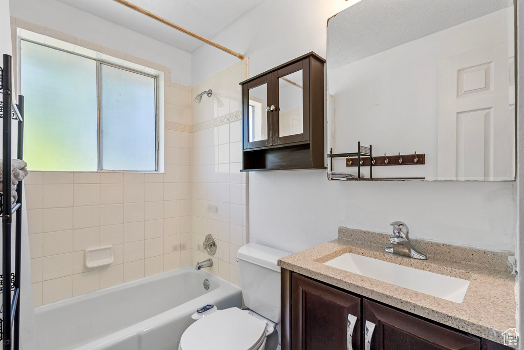 Full bathroom with vanity, toilet, and bathtub / shower combination