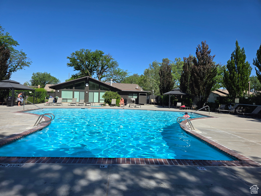 Community pool with a gazebo and a patio area