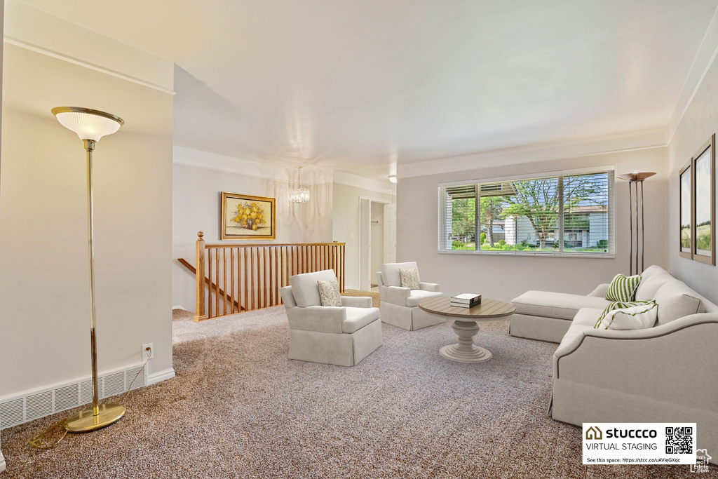 Carpeted living room featuring ornamental molding