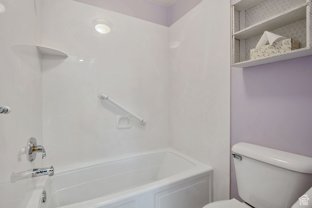 Bathroom with toilet and shower / bath combination
