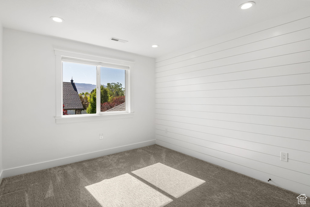 Spare room with carpet flooring, recessed lighting, and baseboards