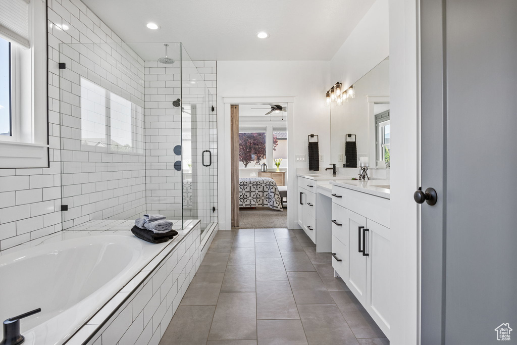 Ensuite bathroom with a shower stall, vanity, a garden tub, tile patterned flooring, and ceiling fan