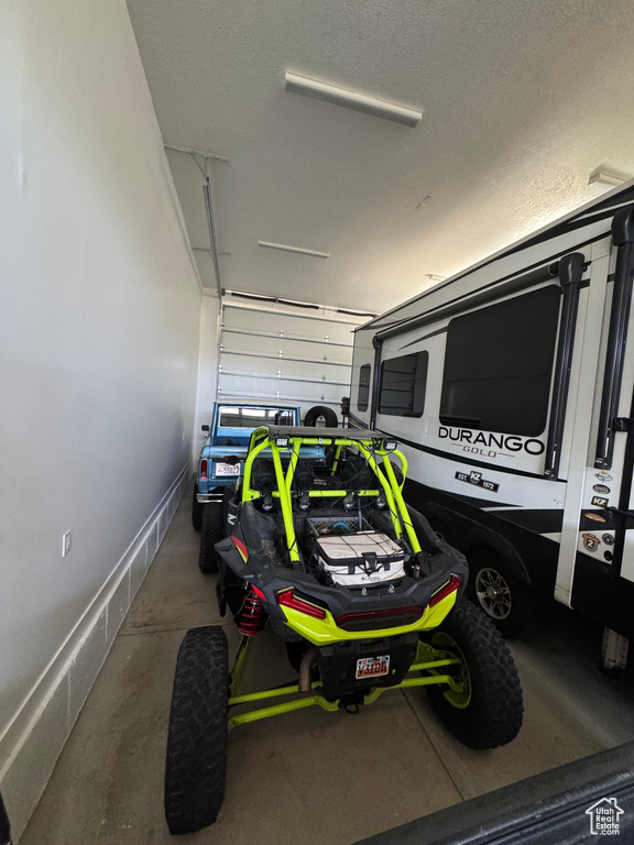 Garage featuring baseboards