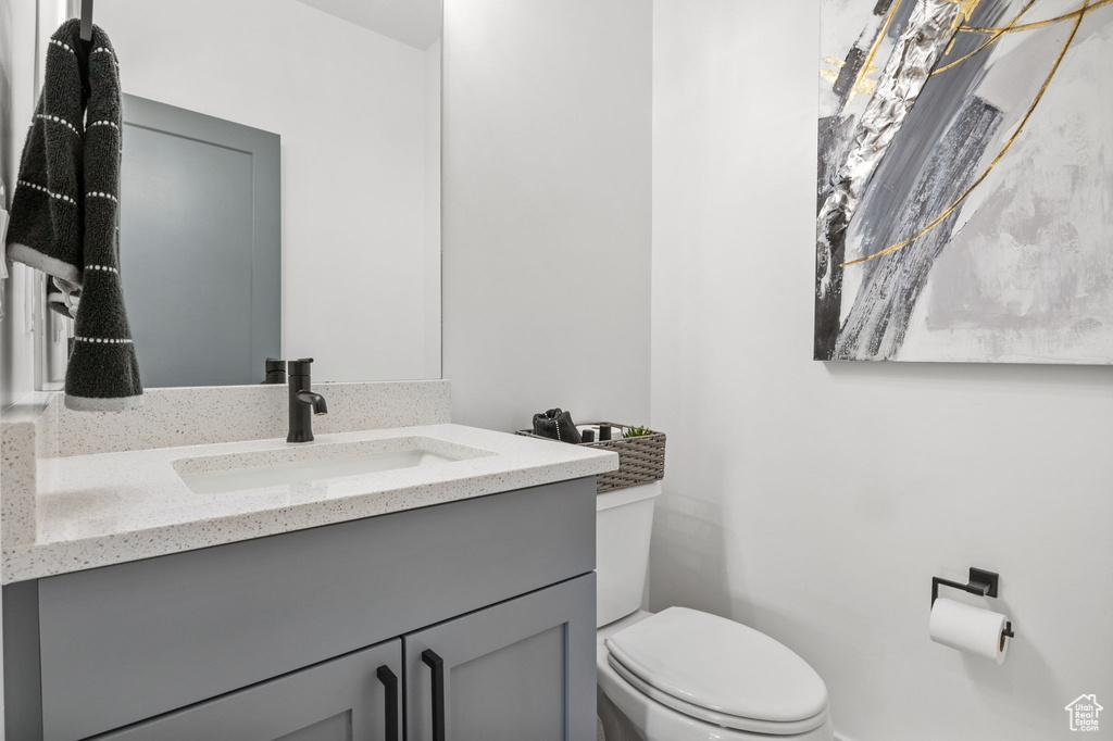 Bathroom featuring toilet and vanity