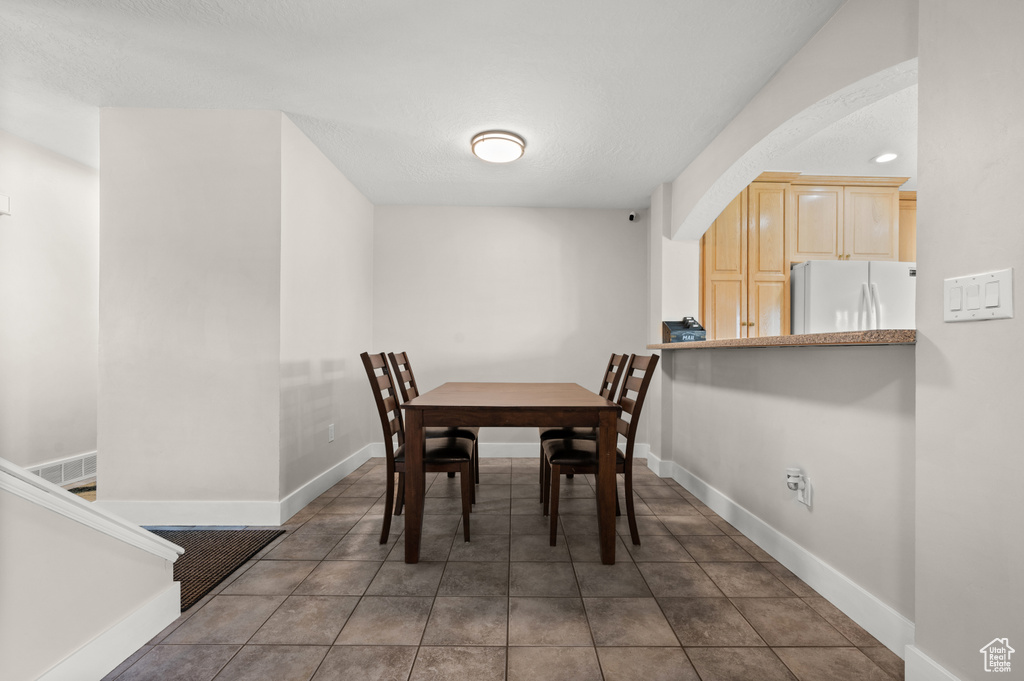 Dining space featuring baseboards and recessed lighting