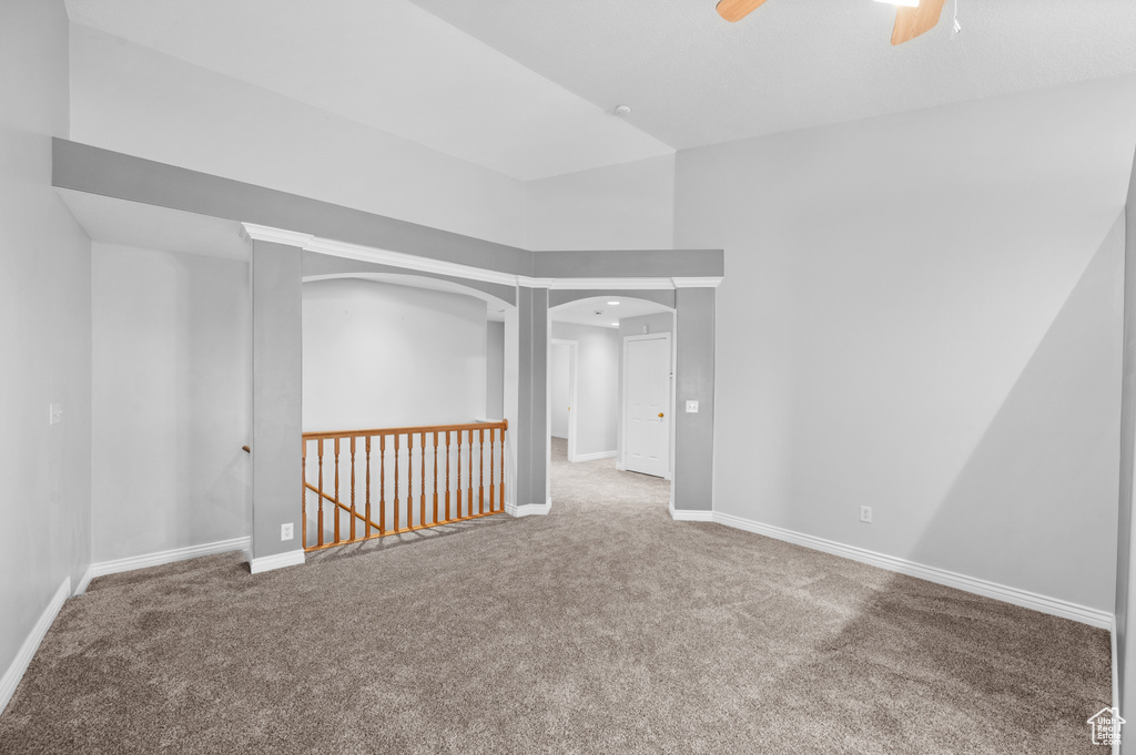 Empty room with carpet and baseboards