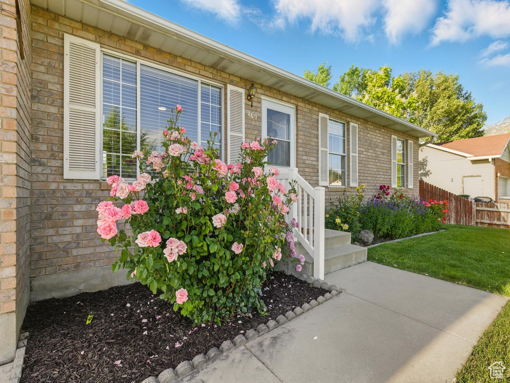 Property entrance featuring brick siding