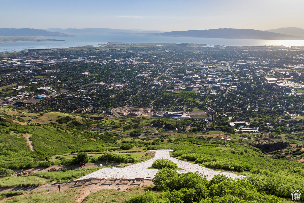 Aerial view of property's location with a mountainous background