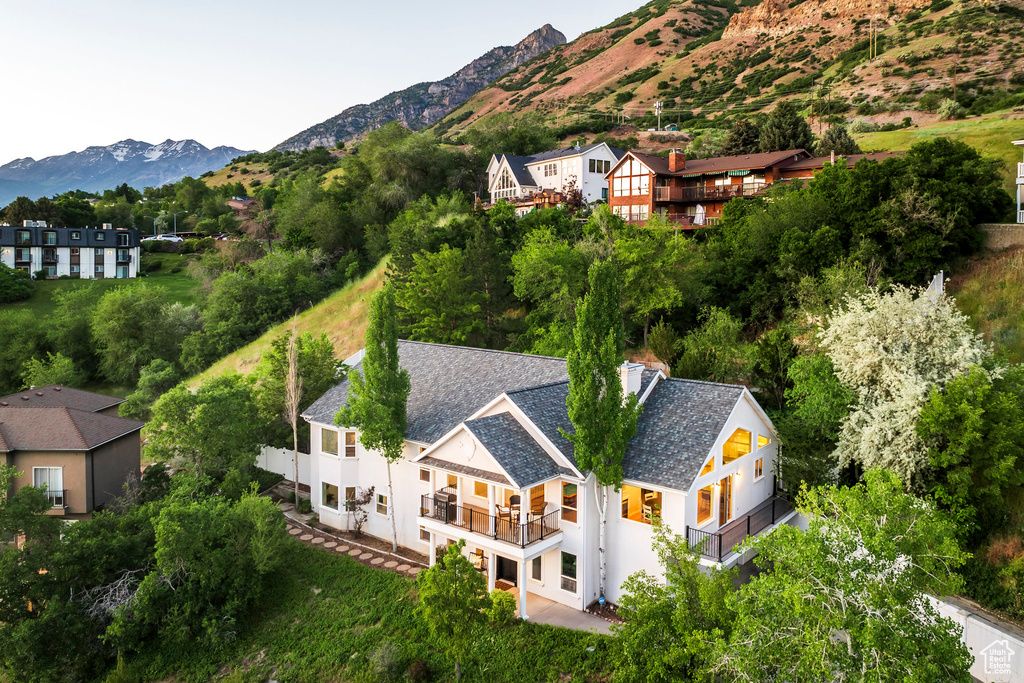View from above of property with a mountain backdrop