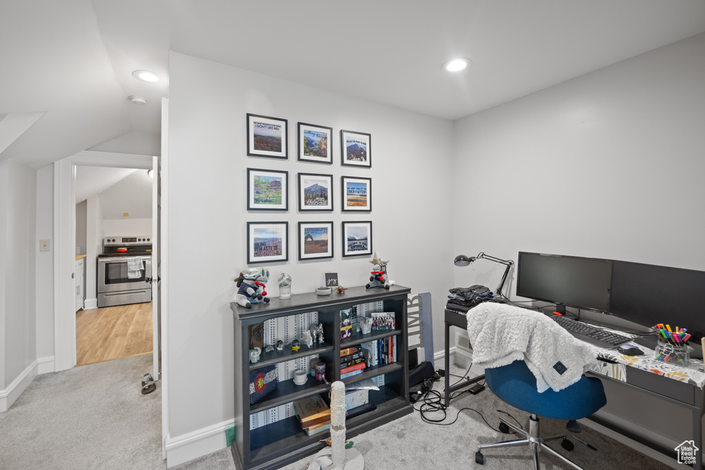 Office area featuring carpet floors, recessed lighting, baseboards, and lofted ceiling