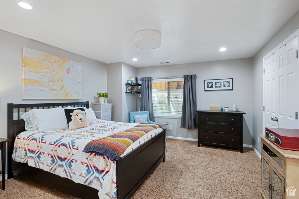 Bedroom with baseboards, recessed lighting, and carpet