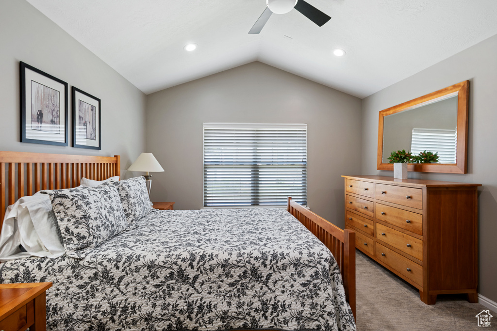 Bedroom featuring light carpet, vaulted ceiling, ceiling fan, and recessed lighting