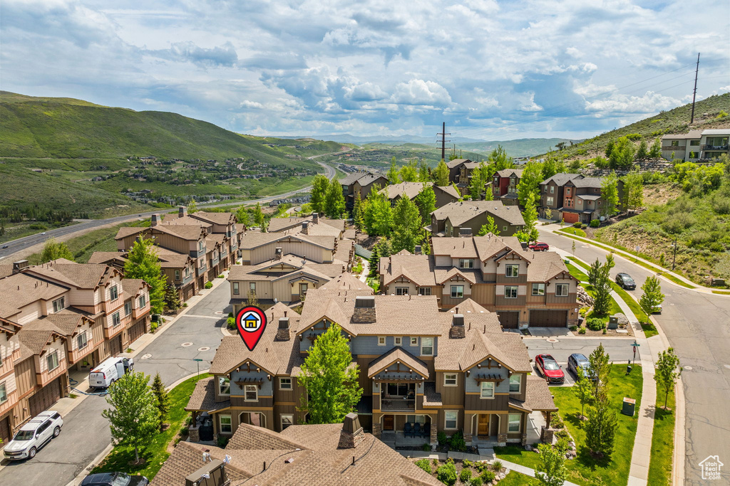 Aerial perspective of suburban area with a mountain backdrop