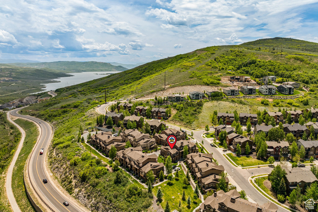 Aerial view of residential area featuring a water and mountain view