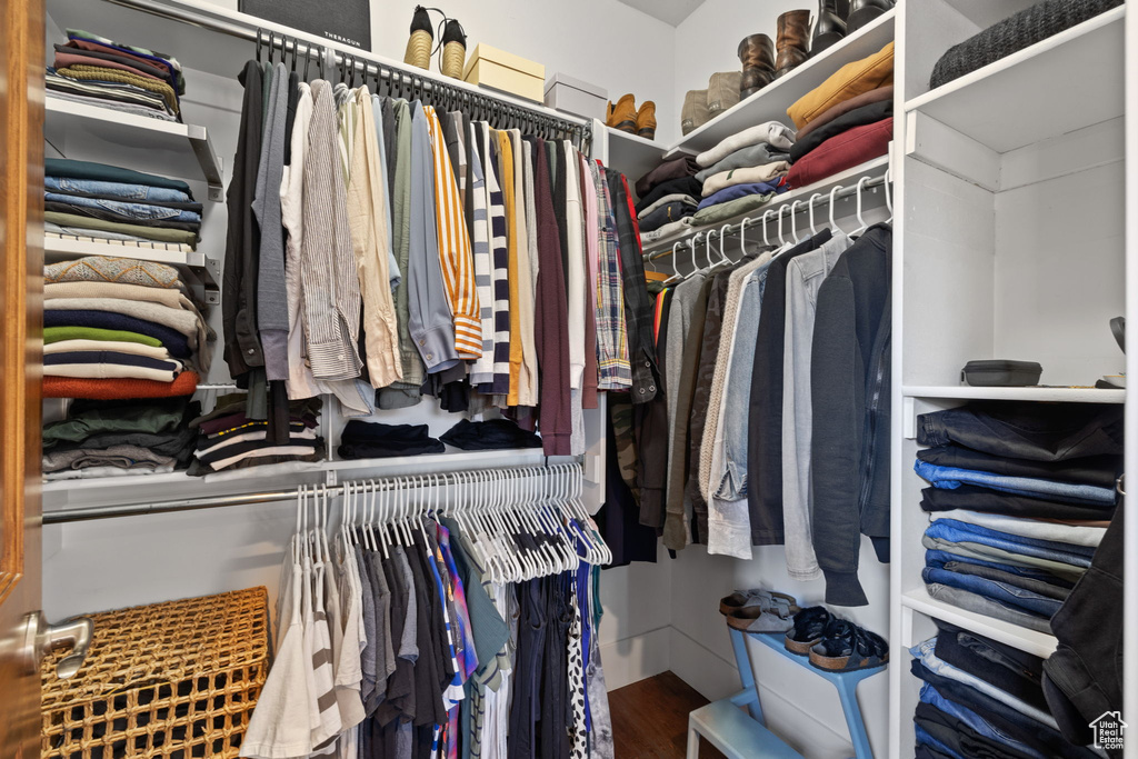 Spacious closet with wood finished floors