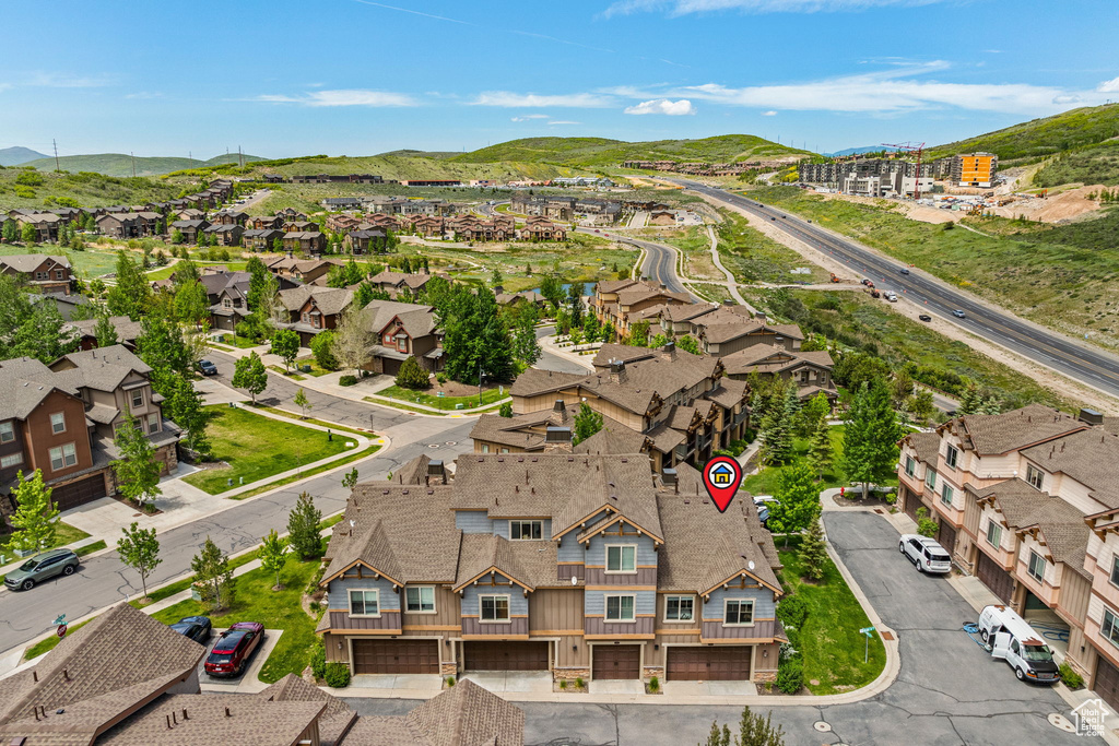Aerial perspective of suburban area featuring a mountain backdrop