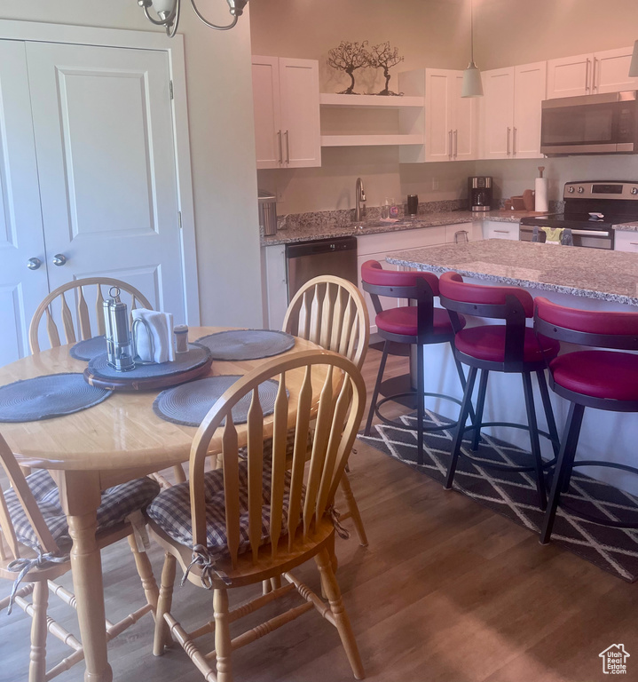 Dining room with dark wood-type flooring