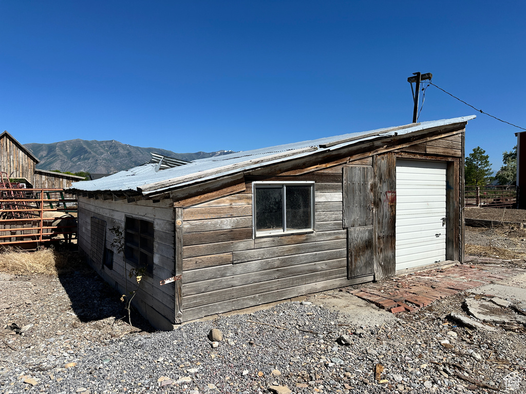 View of outbuilding with a mountain view