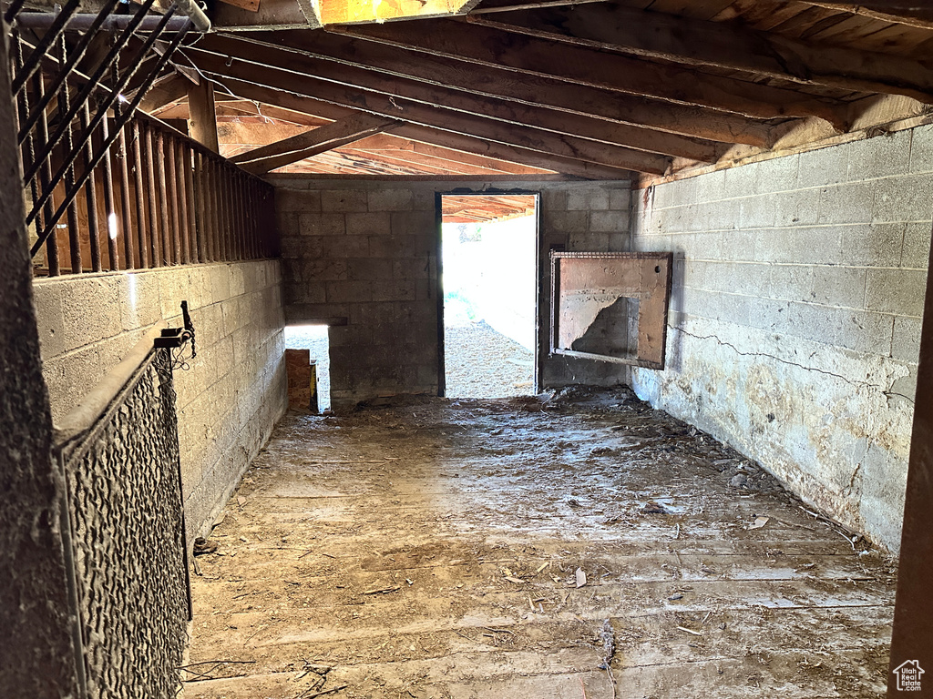 Below grade area featuring concrete block wall