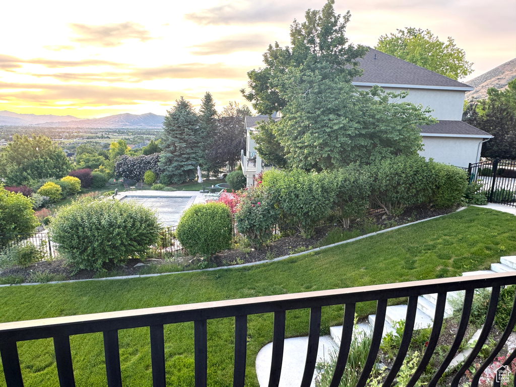 View of yard featuring a mountain view and a balcony