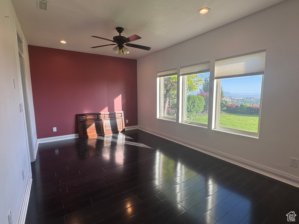 Unfurnished room with baseboards, recessed lighting, ceiling fan, and dark wood-type flooring