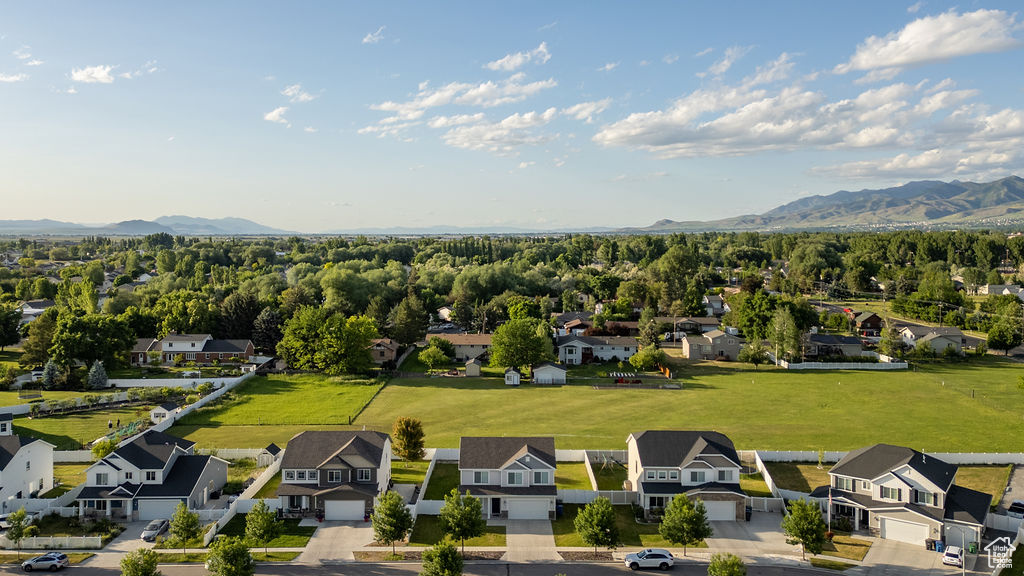 Aerial view of residential area featuring a mountainous background