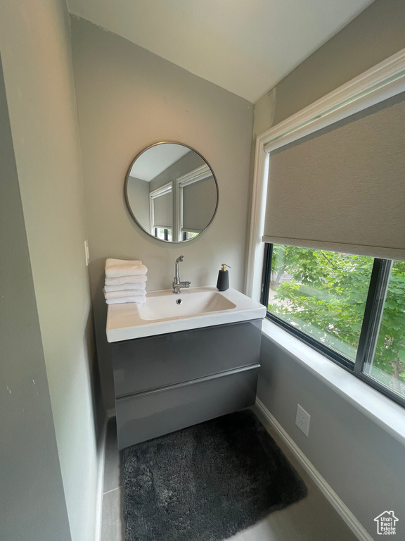 Bathroom with vanity and baseboards