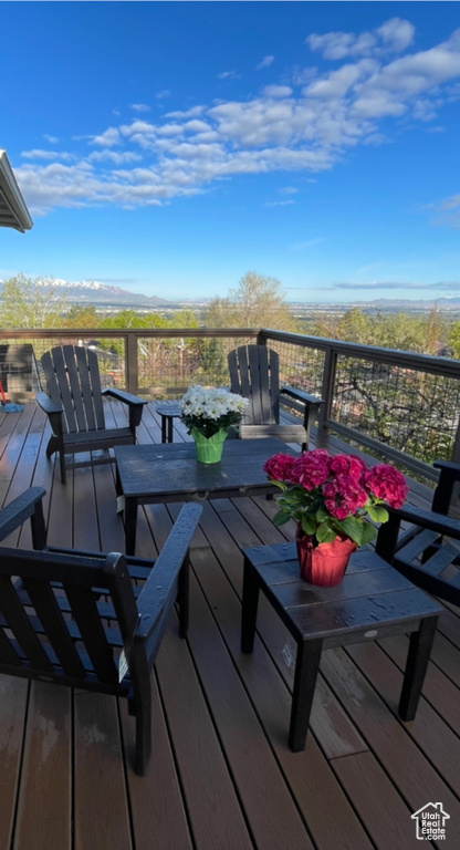 Wooden deck featuring a mountain view