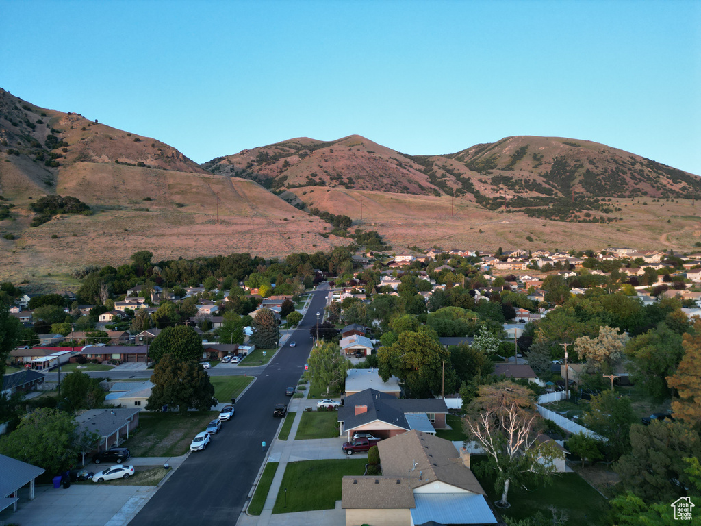 View of mountain backdrop featuring nearby suburban area