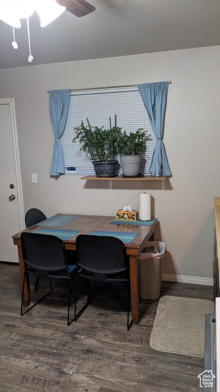 Dining area with wood finished floors, baseboards, and ceiling fan
