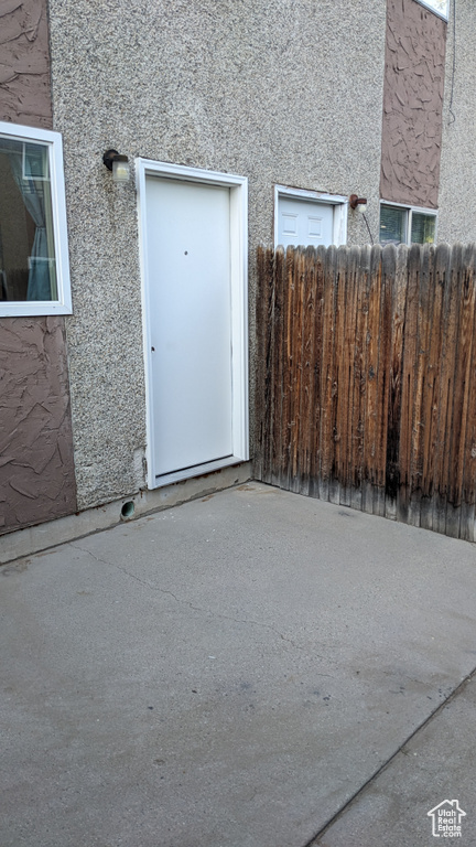 Property entrance with stucco siding