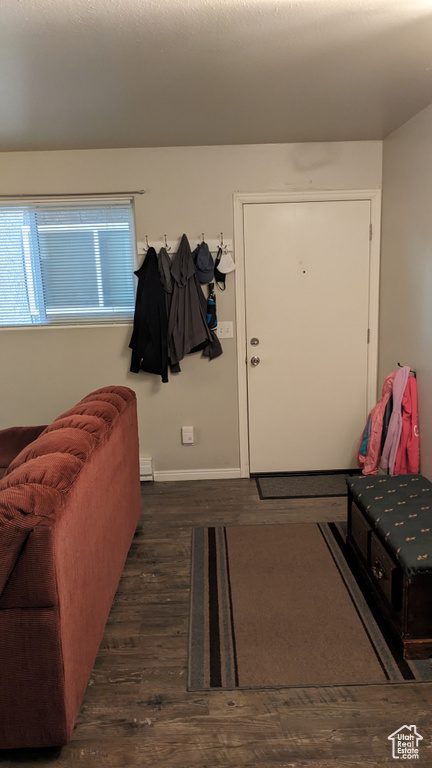 Entrance foyer with wood finished floors and baseboards