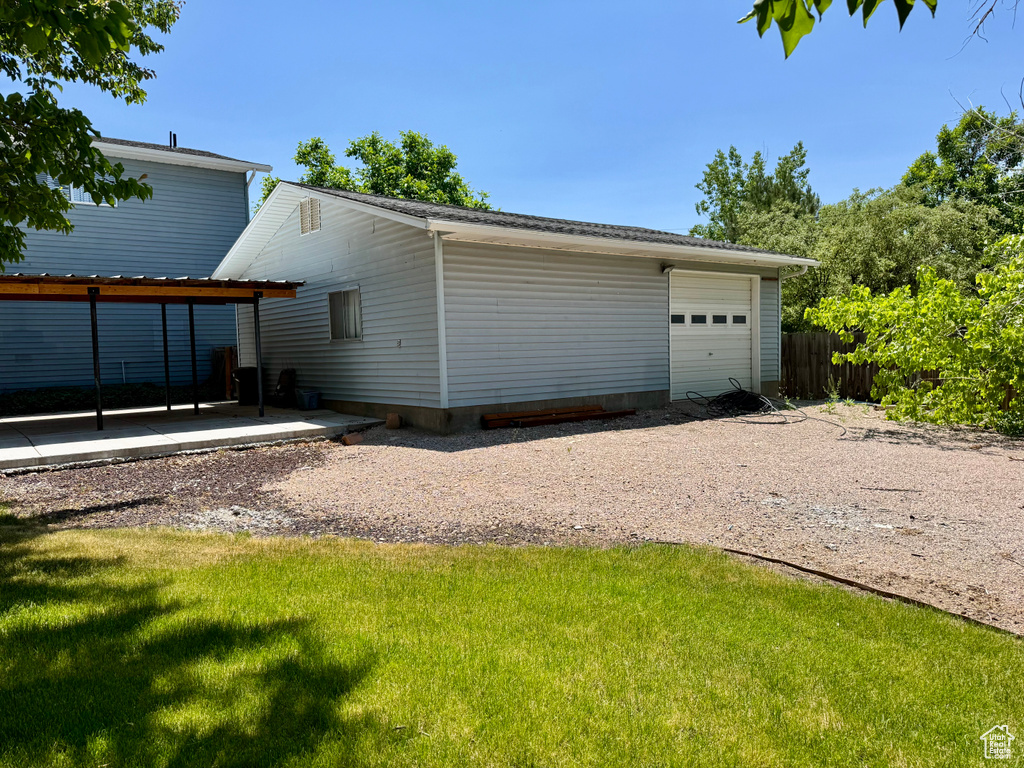 Garage featuring driveway