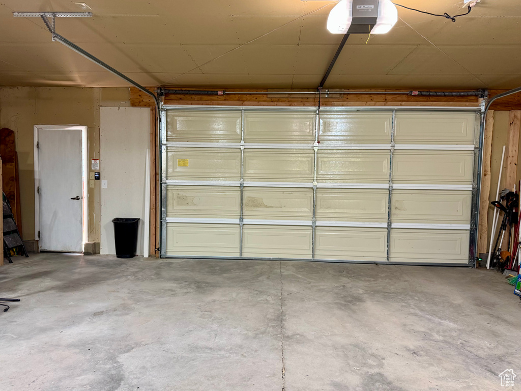 Garage featuring a garage door opener