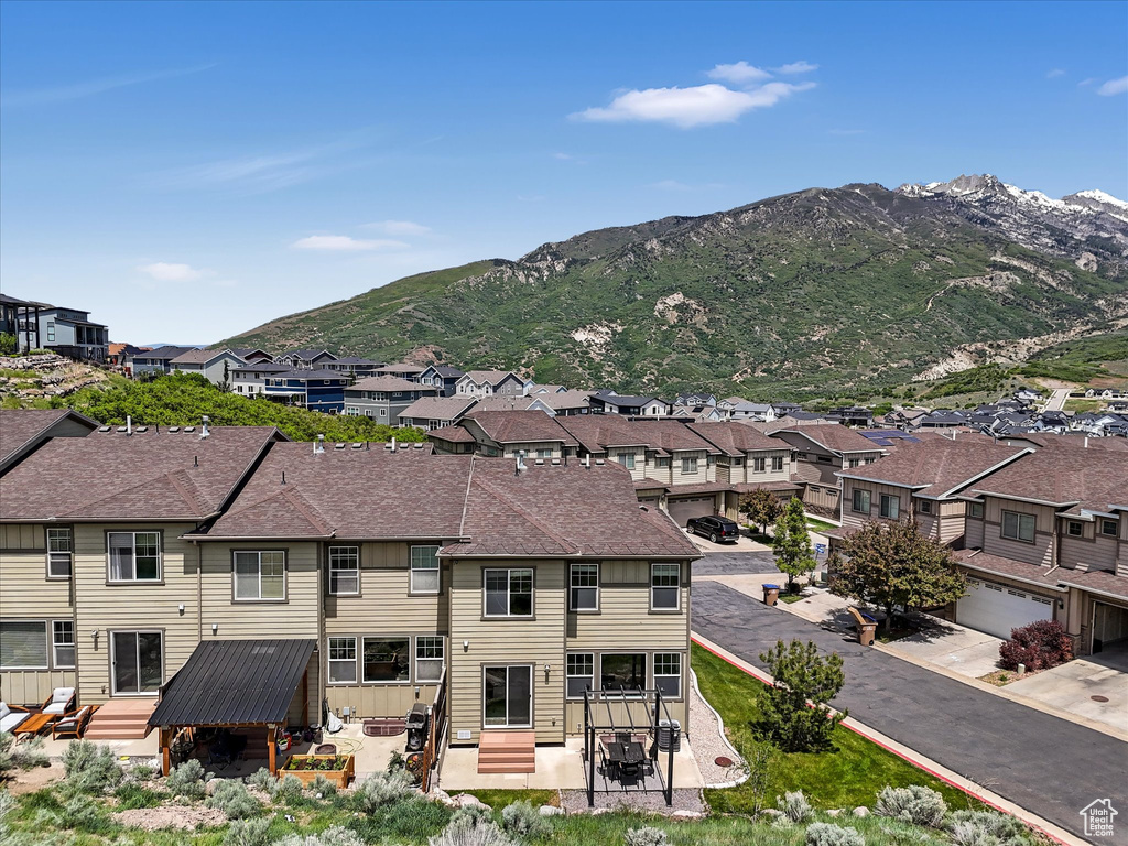 View of mountain background featuring nearby suburban area