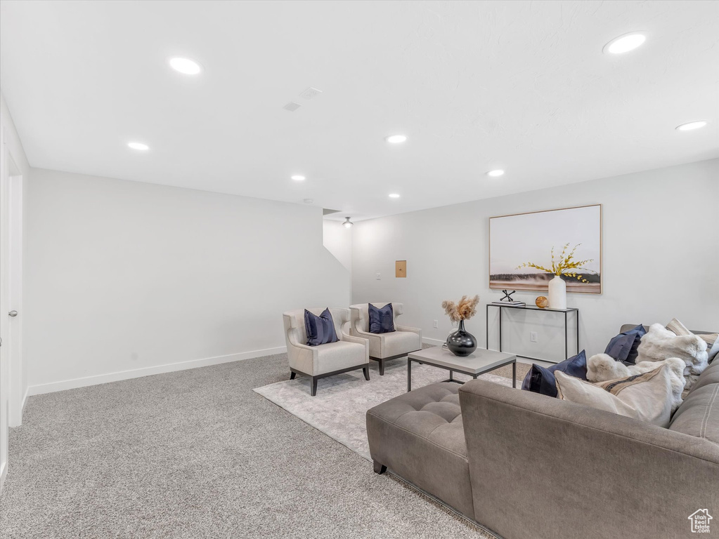 Living room featuring recessed lighting, carpet flooring, and baseboards