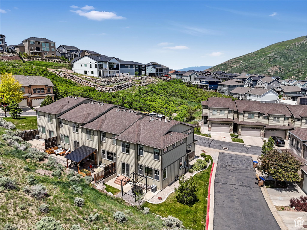 Aerial view of residential area featuring a mountainous background