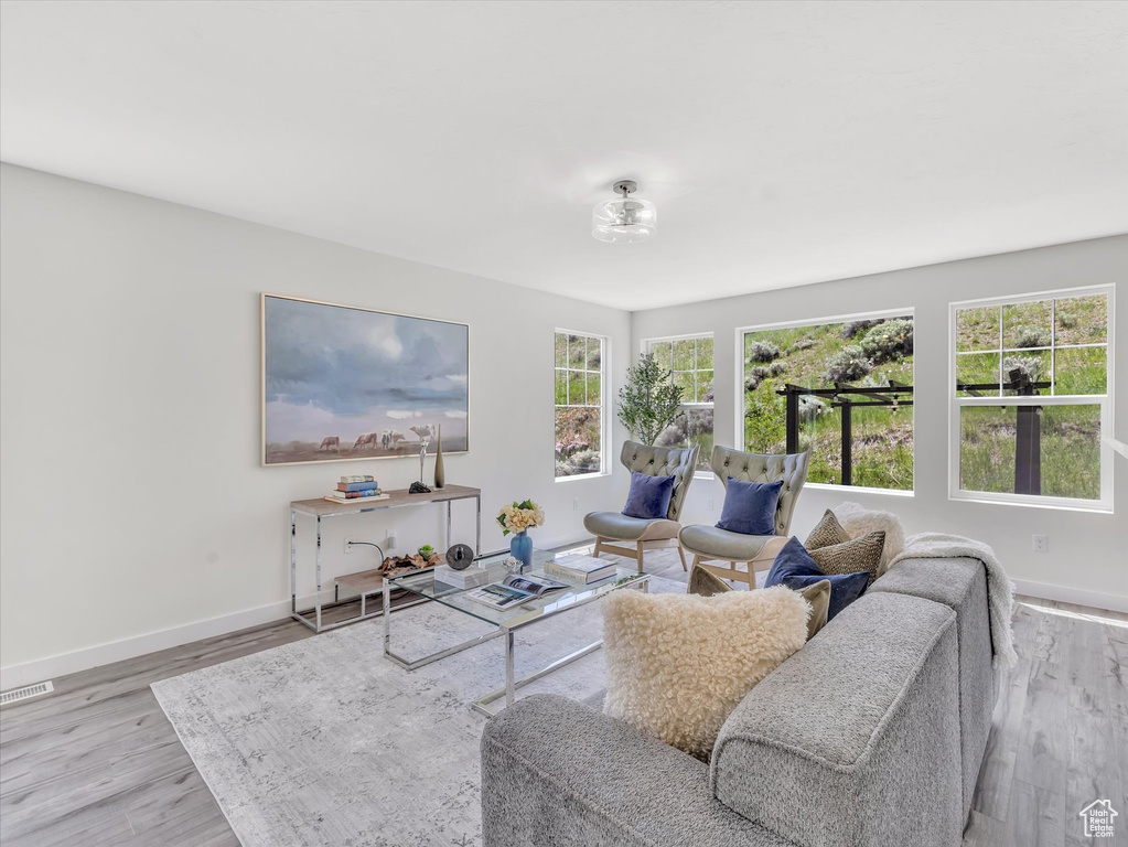 Living area featuring wood finished floors and baseboards